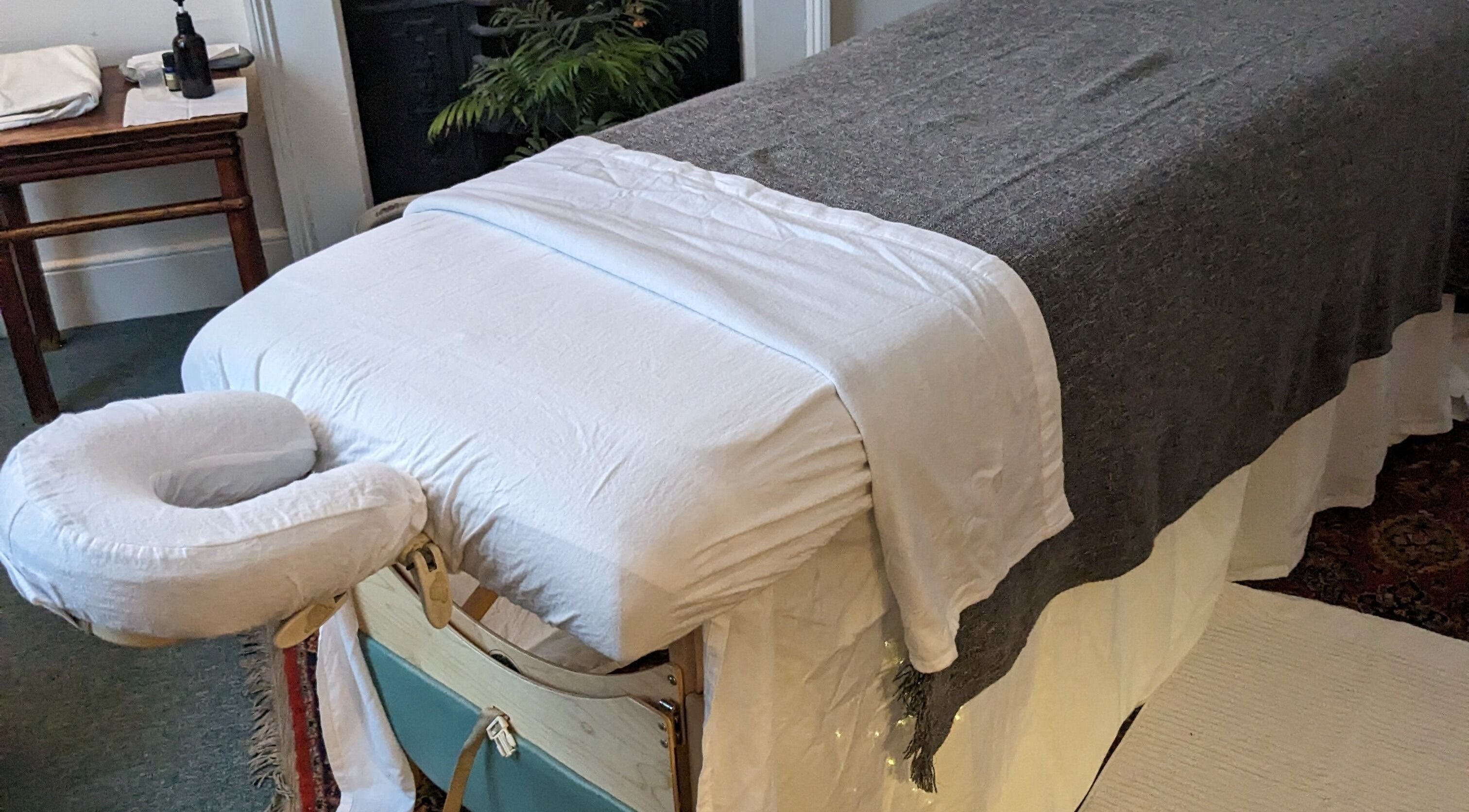 Massage table at KS Holistic Therapies, Bath, England, GB, ready for wellness treatments.