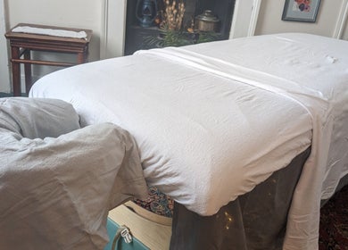 Massage table at KS Holistic Therapies in Bath, England, GB. Ready for a calming therapy session.