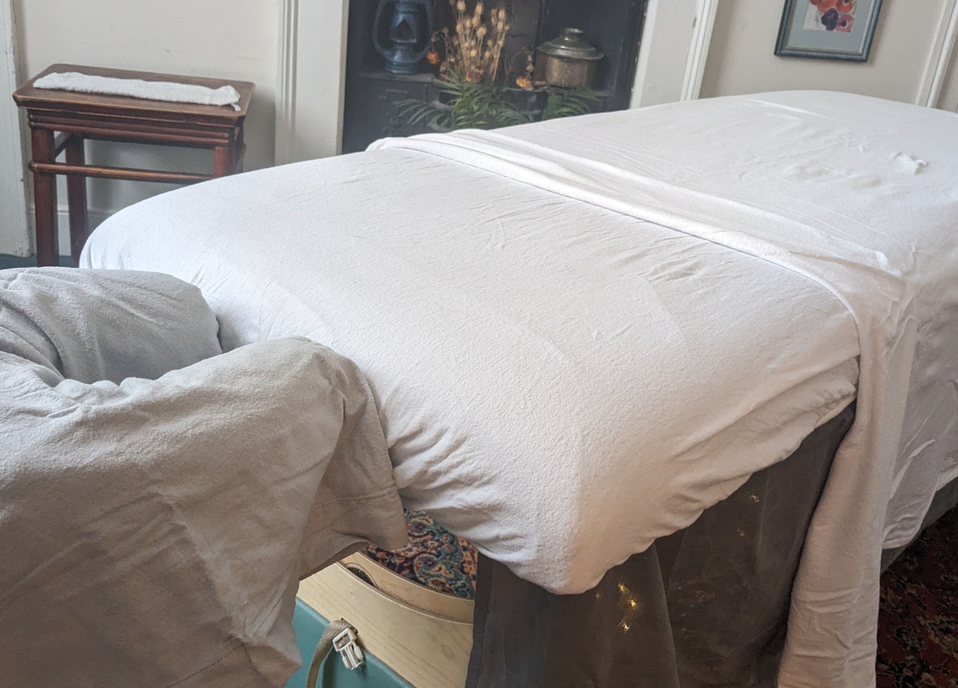 Massage table at KS Holistic Therapies in Bath, England, GB. Ready for a calming therapy session.