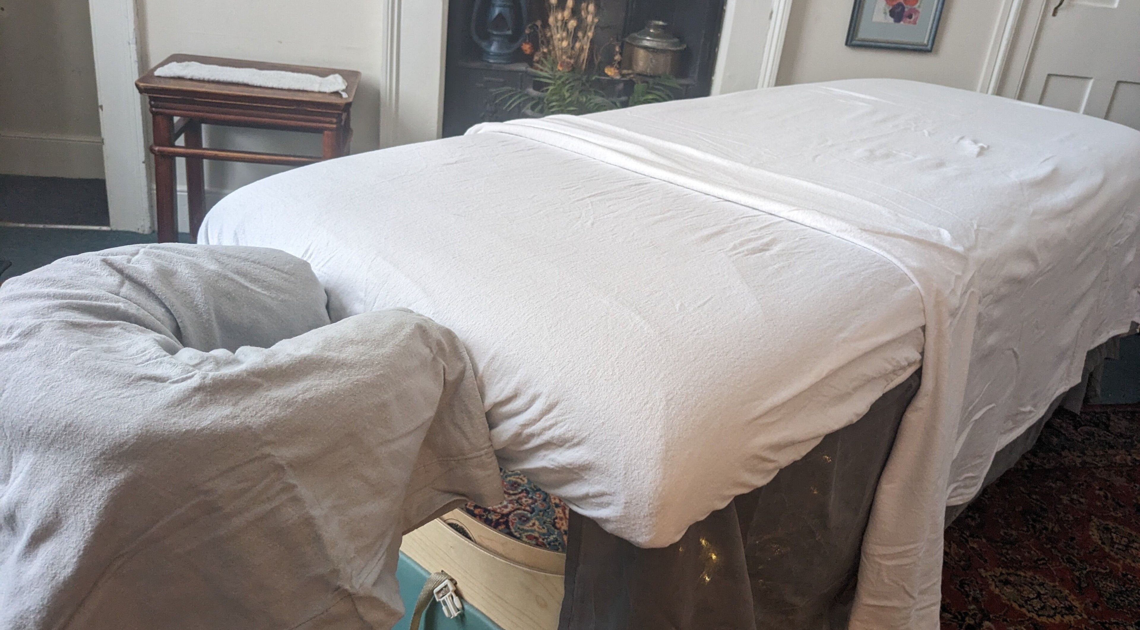 Massage table at KS Holistic Therapies in Bath, England, GB. Ready for a calming therapy session.