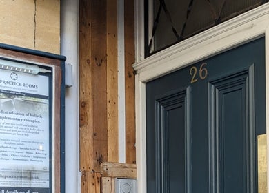 Entrance of KS Holistic Therapies in Bath, England, GB showcasing welcoming dark door.