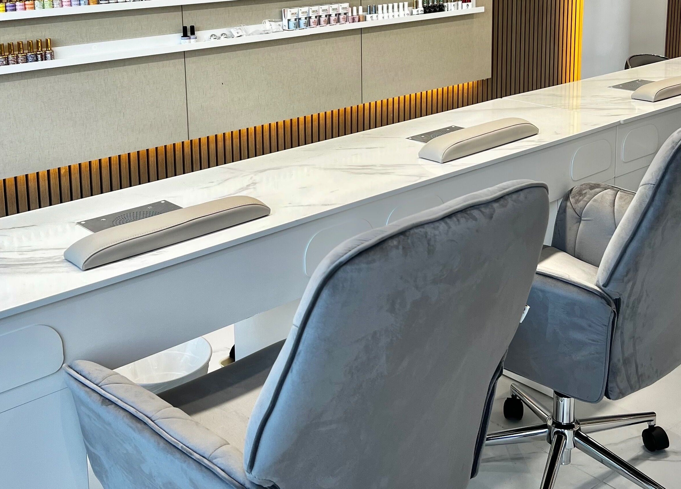 Modern nail salon seating at Nails Brows Stillorgan, Dublin, County Dublin, IE with sleek chairs and manicure stations.