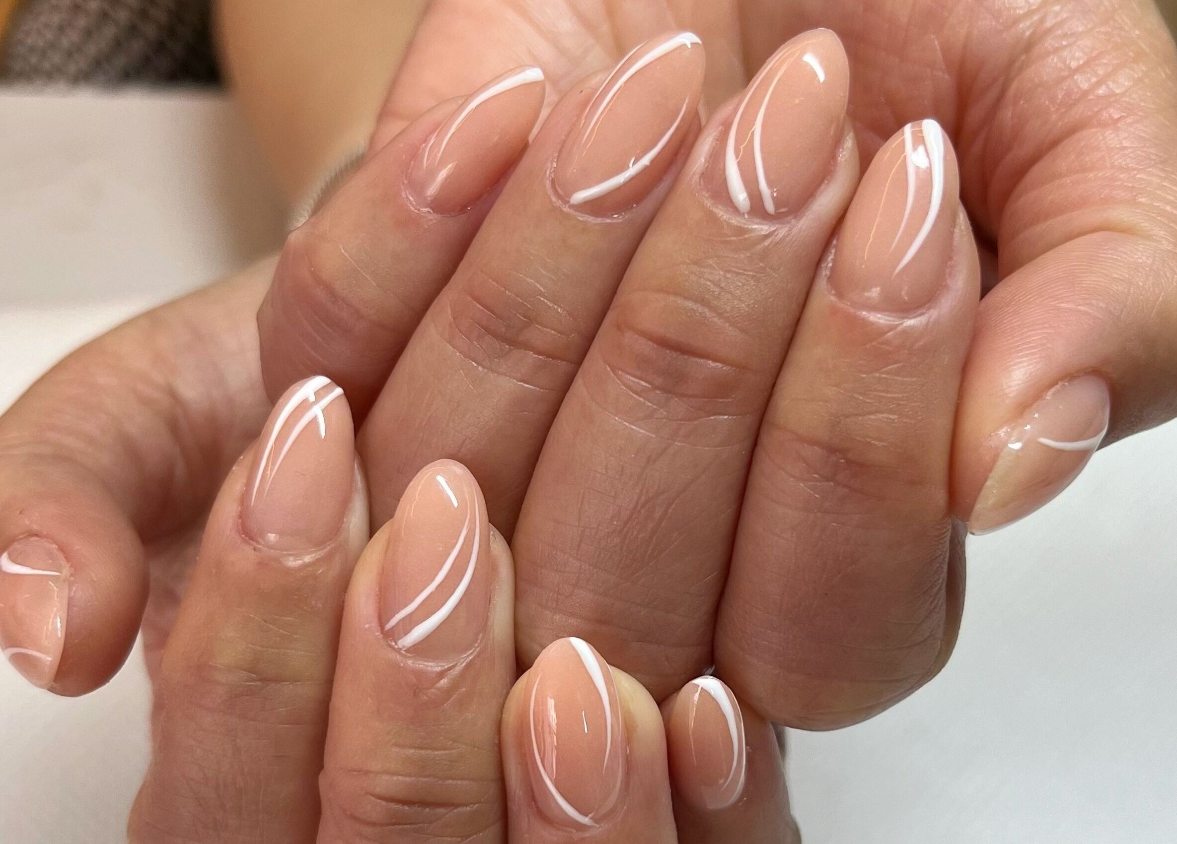 Elegant nail art design at Nails Brows Stillorgan, Dublin, County Dublin, IE showcasing delicate white accents.