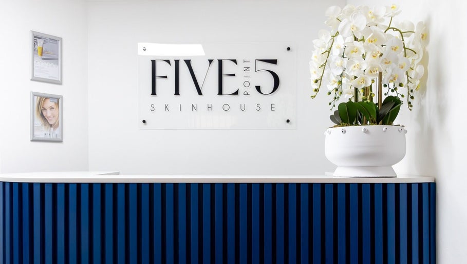 Reception area at Five Point 5 SkinHouse, Roodepoort, Gauteng, ZA featuring a stylish blue front desk.