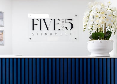 Reception area at Five Point 5 SkinHouse, Roodepoort, Gauteng, ZA featuring a stylish blue front desk.