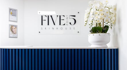 Reception area at Five Point 5 SkinHouse, Roodepoort, Gauteng, ZA featuring a stylish blue front desk.