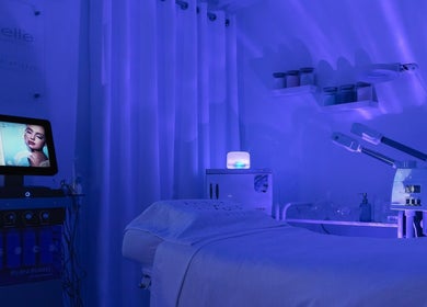 Tranquil treatment room at Five Point 5 SkinHouse in Roodepoort, Gauteng, ZA with calming blue lighting.