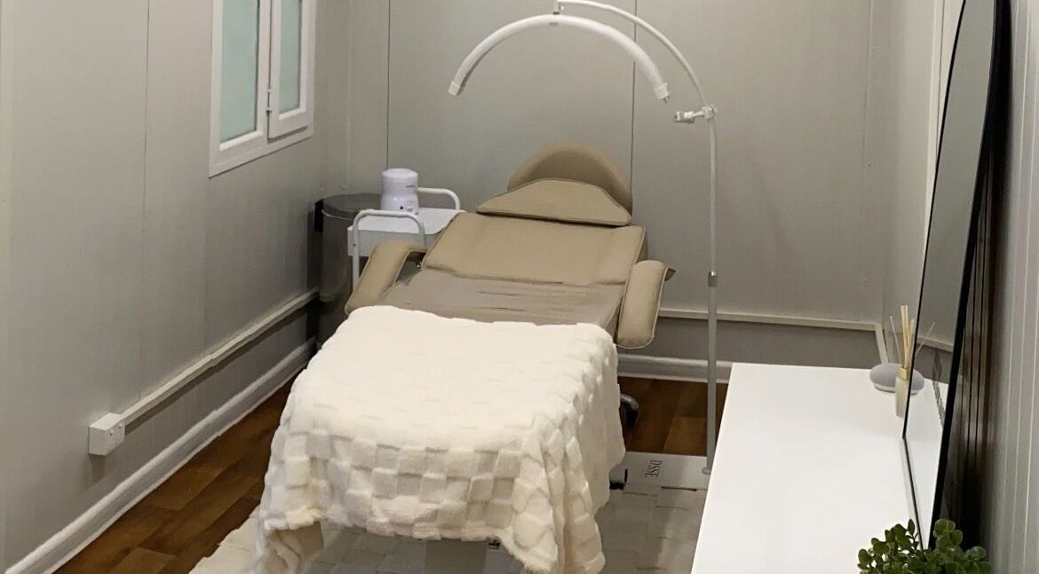 Calming treatment room at Arched Artistry, Kilmore, Victoria, AU, featuring a comfortable spa bed.