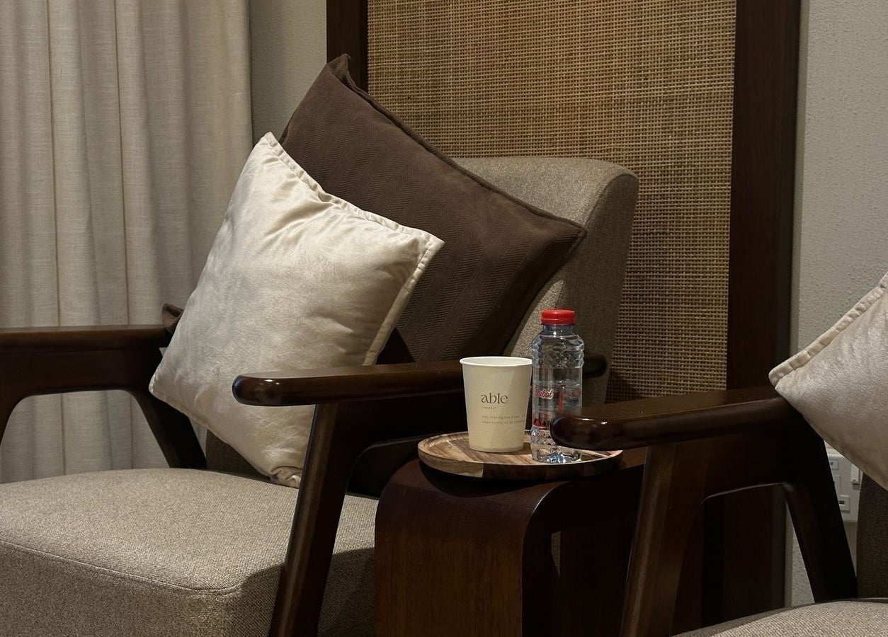 Elegant seating with cushions at Able Beauty Lounge, Kabir, Emirate Of Umm Al Quwain, AE.