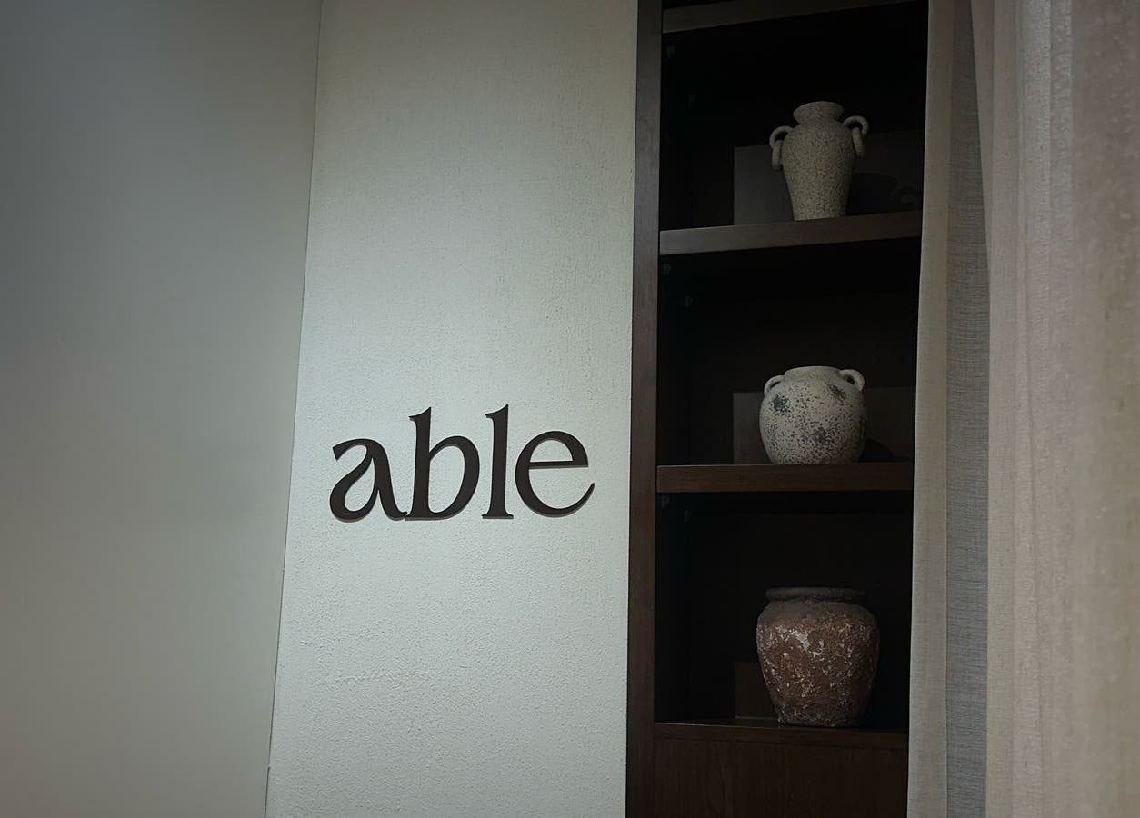 Elegant decor at Able Beauty Lounge, Kabir, Emirate Of Umm Al Quwain, AE featuring artistic vases on shelves.