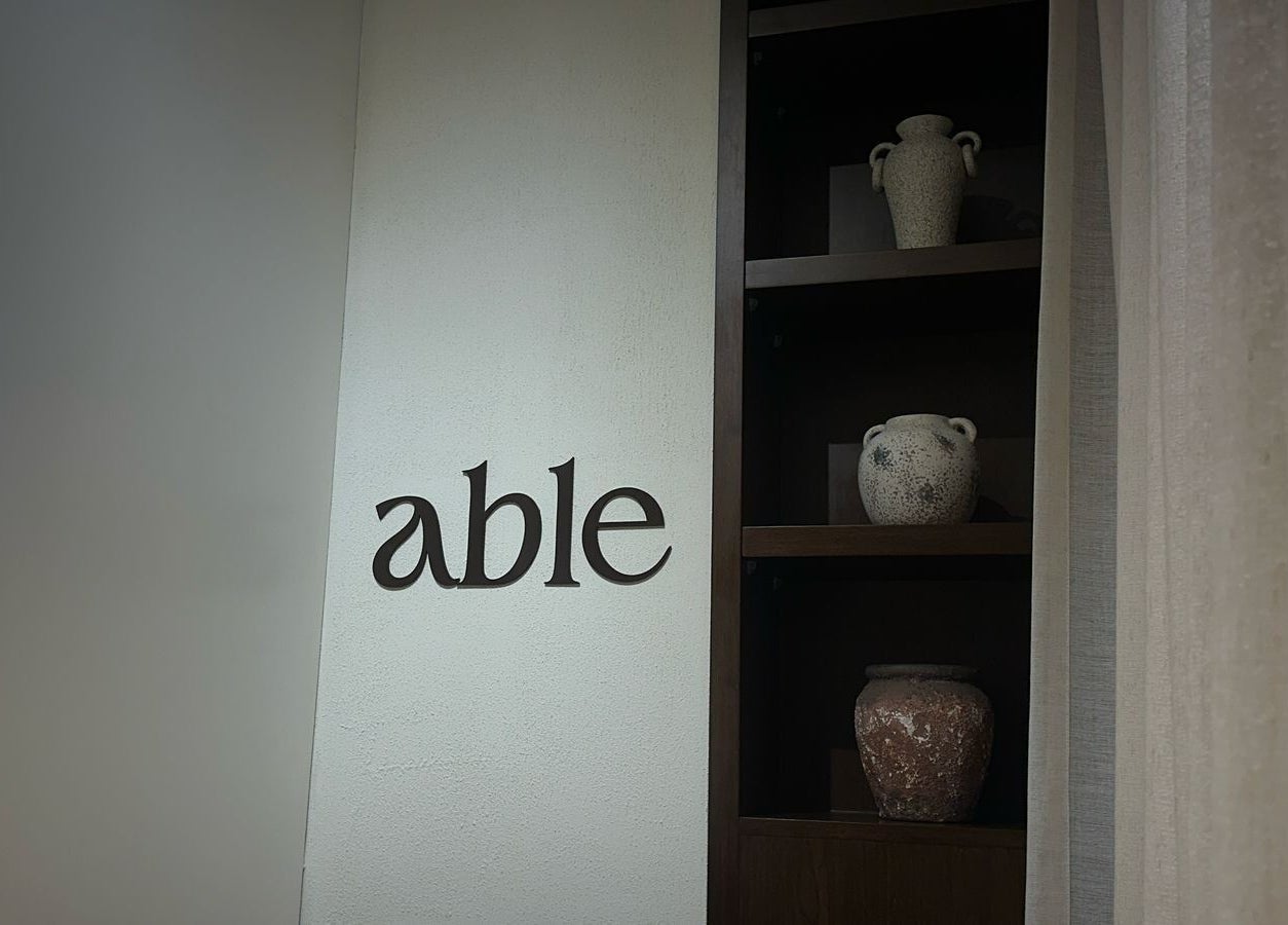 Elegant decor at Able Beauty Lounge, Kabir, Emirate Of Umm Al Quwain, AE featuring artistic vases on shelves.