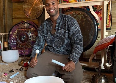 Massage therapist at Mobile Massage & Relax in Runwell, England, offering sound therapy with bowls and gongs.