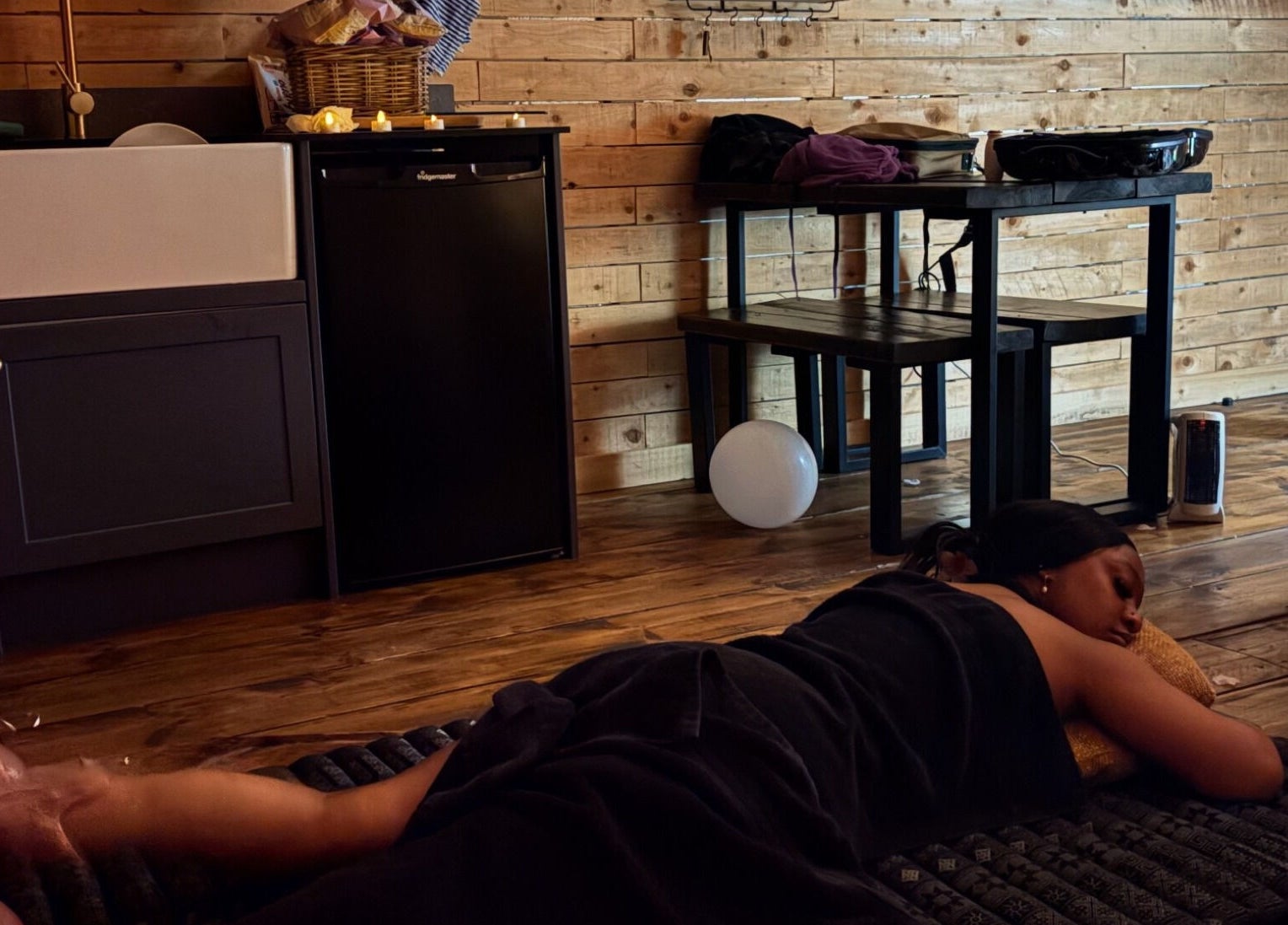 Relaxing massage at Mobile Massage & Relax (The Zen Den) in Runwell, England, GB with calming wooden decor.