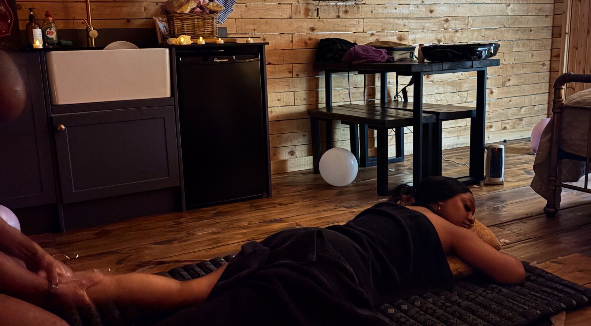 Relaxing massage at Mobile Massage & Relax (The Zen Den) in Runwell, England, GB with calming wooden decor.