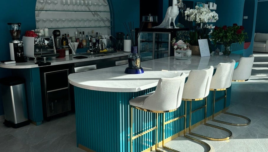 Stylish bar area at Velvet & Pearls Beauty Club, Limassol, Limassol, CY featuring modern decor and seating.