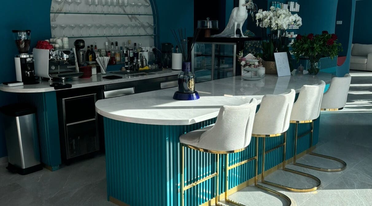 Stylish bar area at Velvet & Pearls Beauty Club, Limassol, Limassol, CY featuring modern decor and seating.