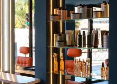 Product shelves at Velvet & Pearls Beauty Club, Limassol, Limassol, CY glistening with luxury beauty items.