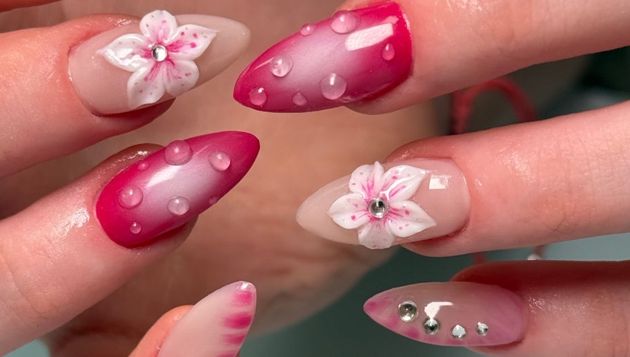 Intricate nail art with floral designs at Nail Devotion, Bath, England, GB, showcasing stylish beauty trends.