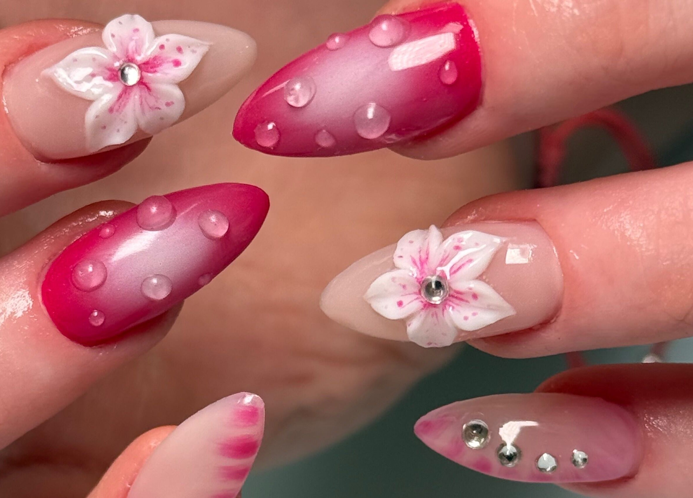 Intricate nail art with floral designs at Nail Devotion, Bath, England, GB, showcasing stylish beauty trends.