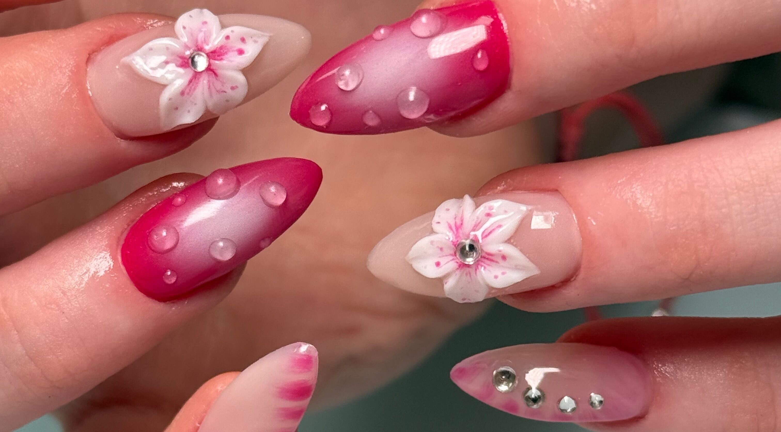 Intricate nail art with floral designs at Nail Devotion, Bath, England, GB, showcasing stylish beauty trends.