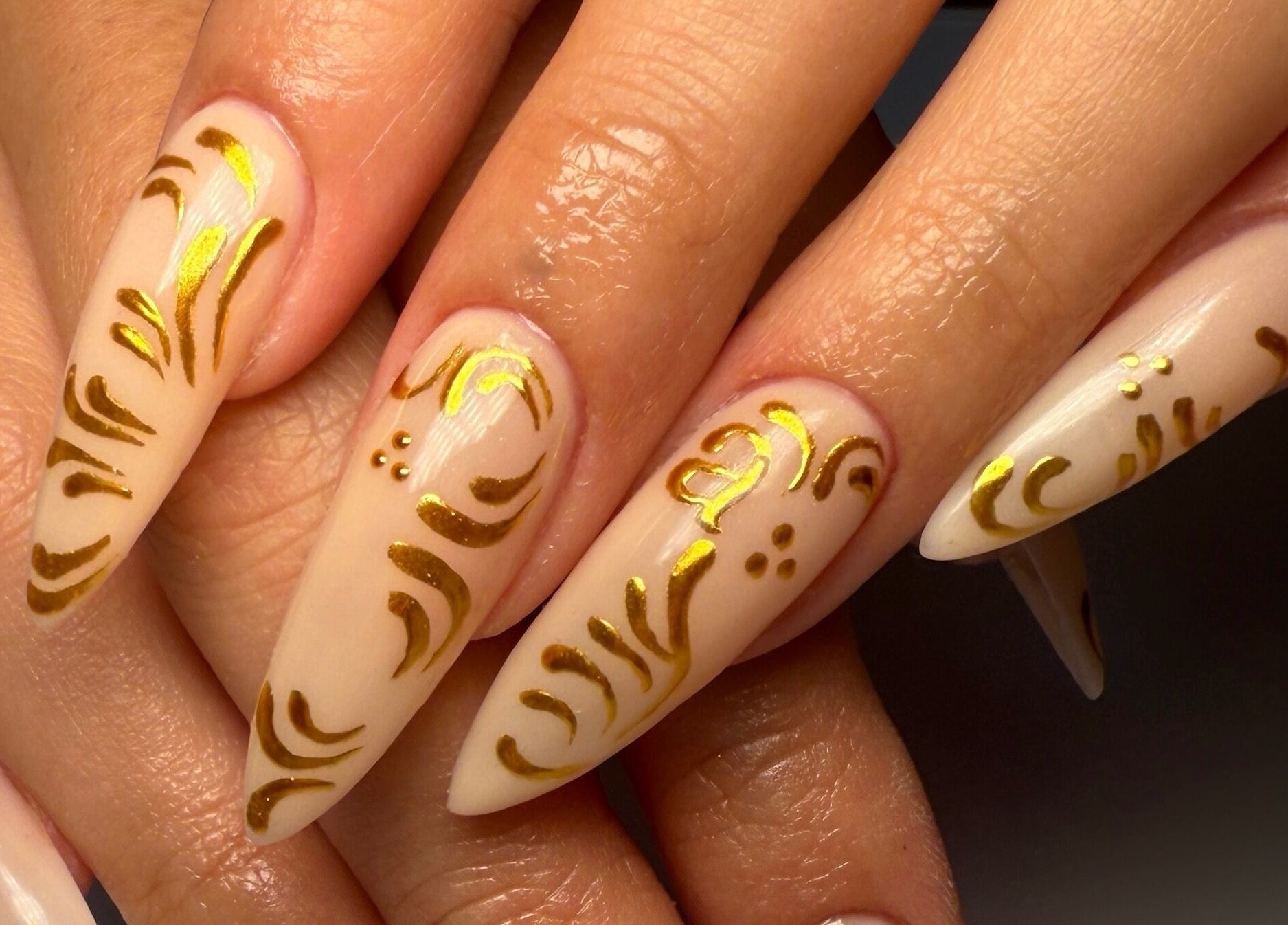 Elegant gold nail art at Nail Devotion, Bath, England, GB.