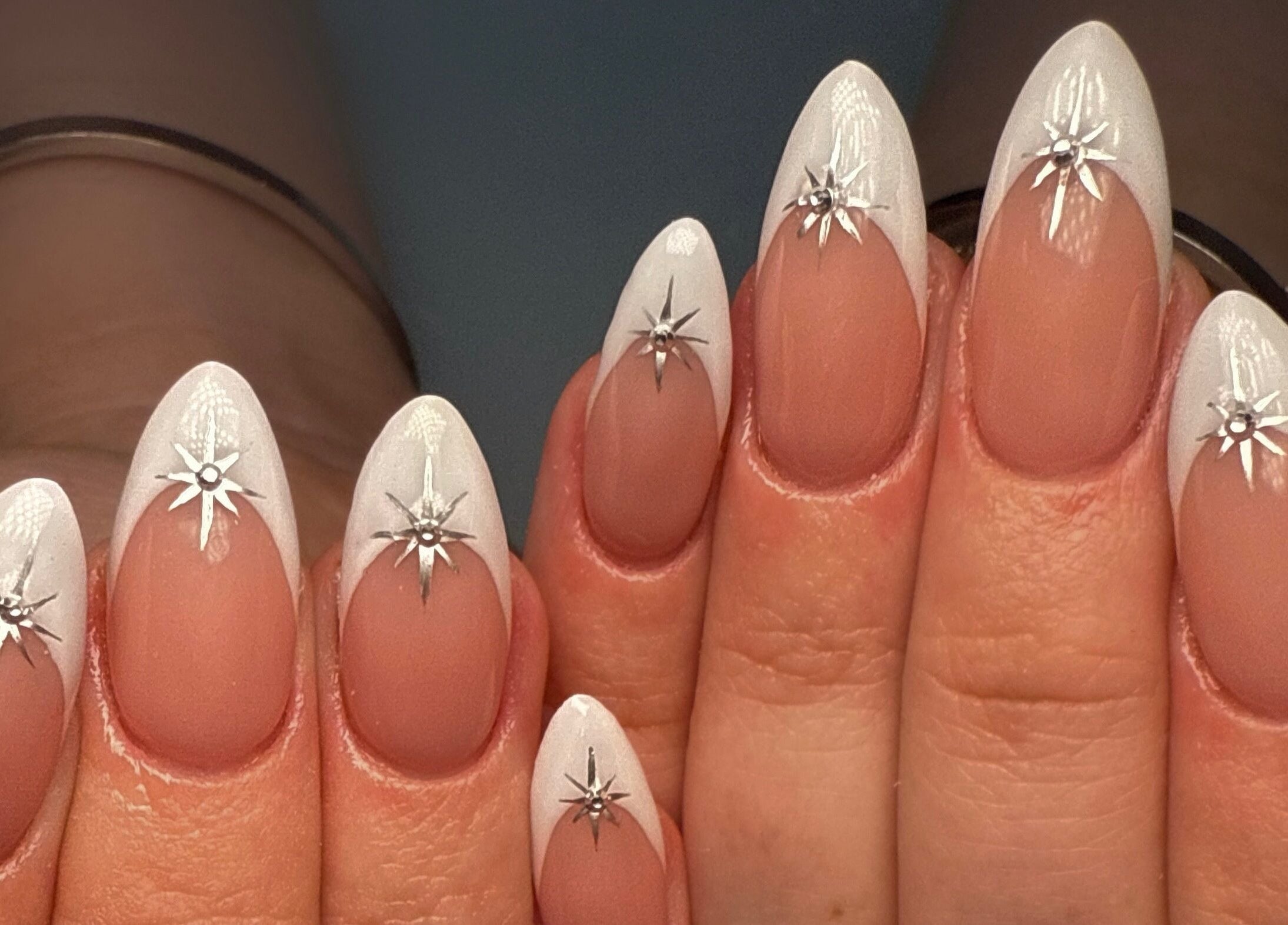 Elegant star-themed nails at Nail Devotion in Bath, England, GB highlighting detailed silver star accents.