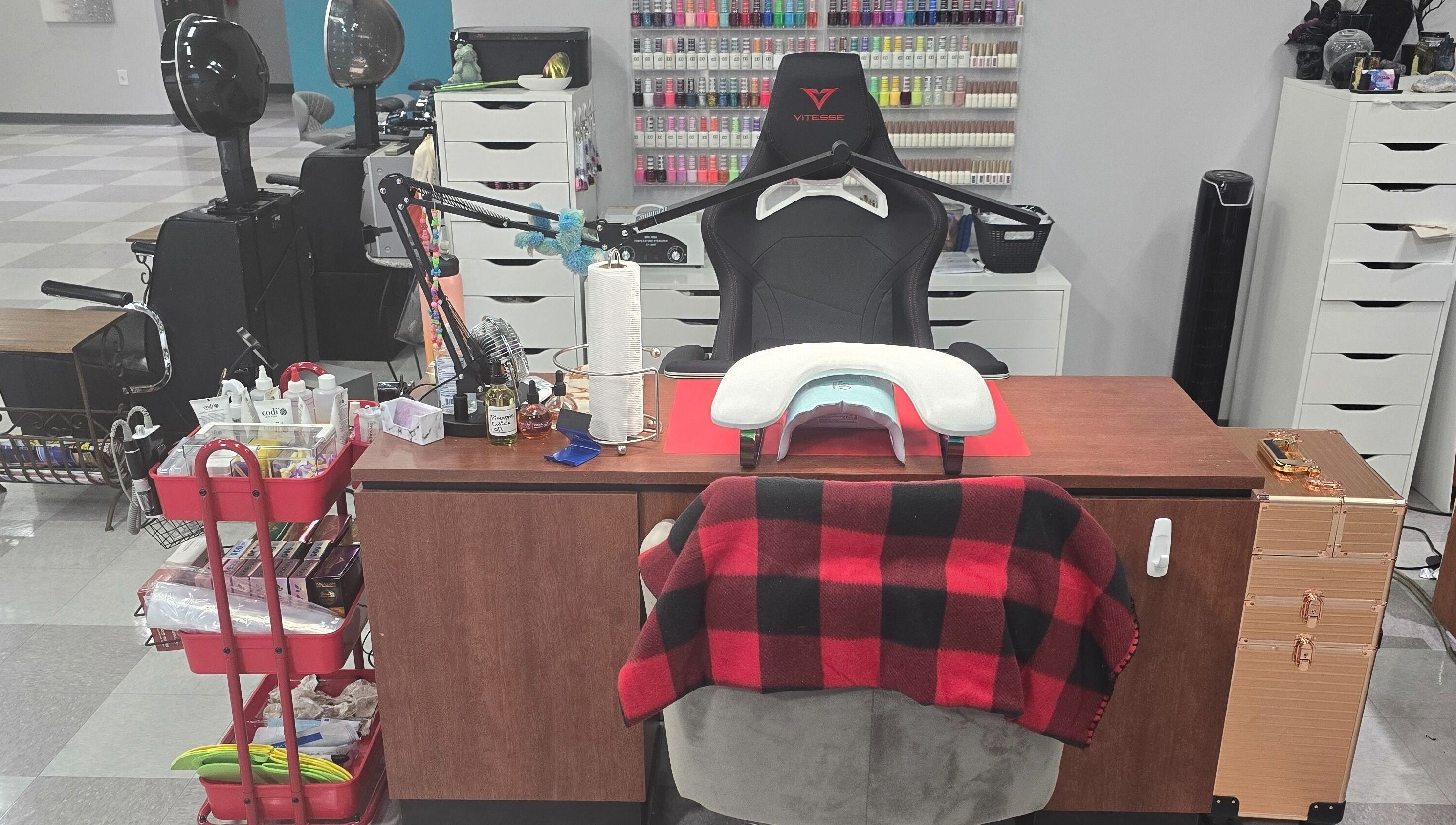 Cozy nail care station at Sasco Nails in Henderson, Nevada, US, featuring a chair and manicure tools.