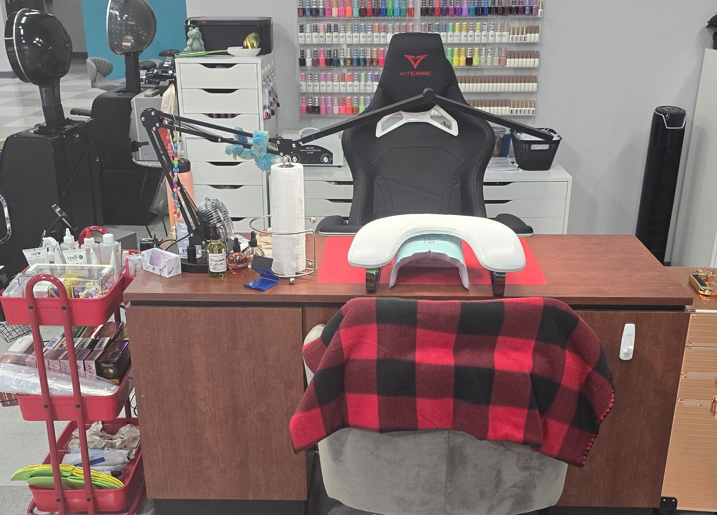 Cozy nail care station at Sasco Nails in Henderson, Nevada, US, featuring a chair and manicure tools.