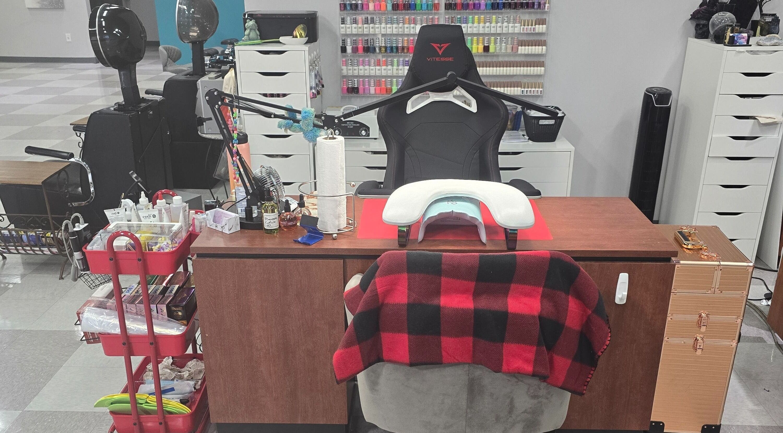 Cozy nail care station at Sasco Nails in Henderson, Nevada, US, featuring a chair and manicure tools.