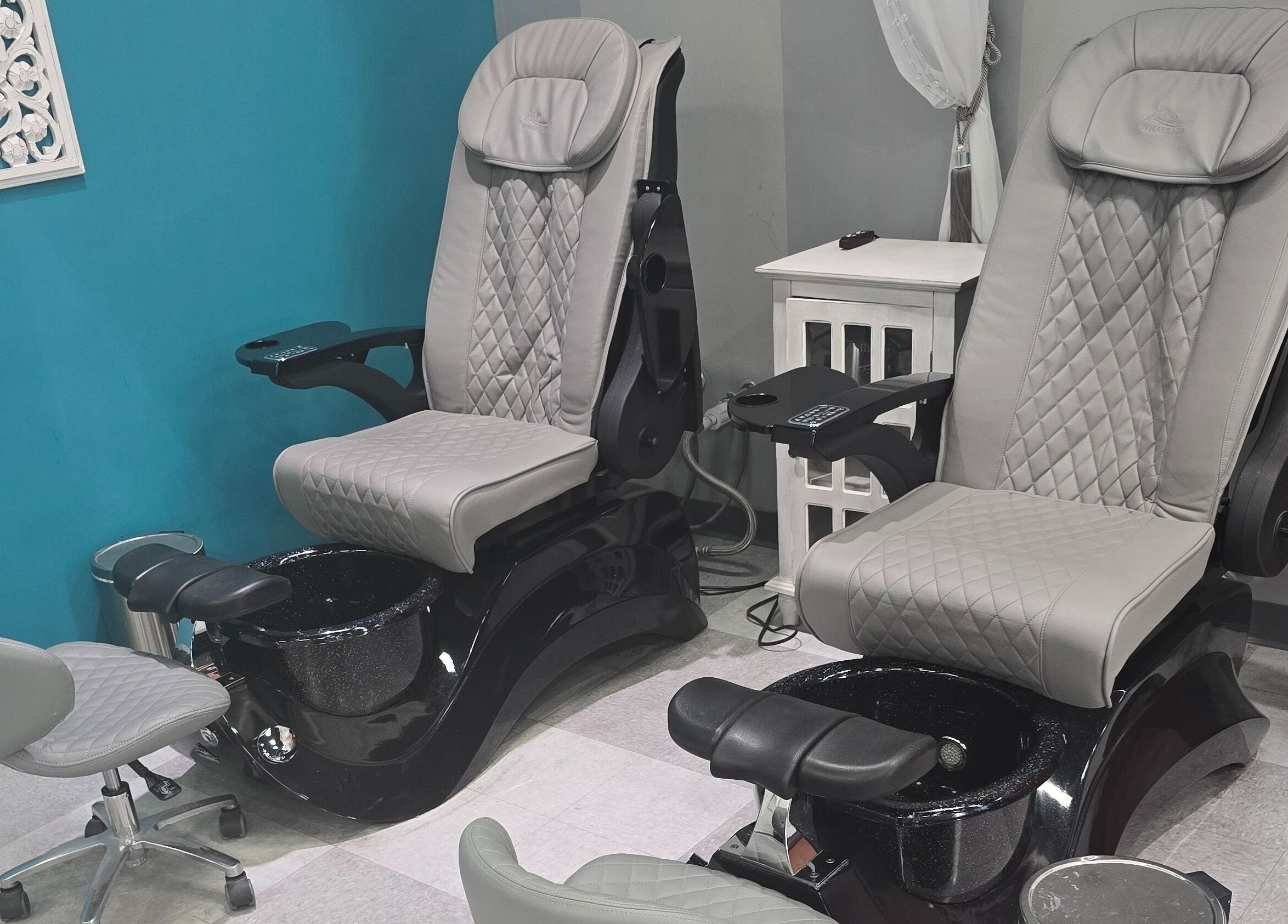 Elegant pedicure spa chairs at Sasco Nails in Henderson, Nevada, US with plush seating and modern design.