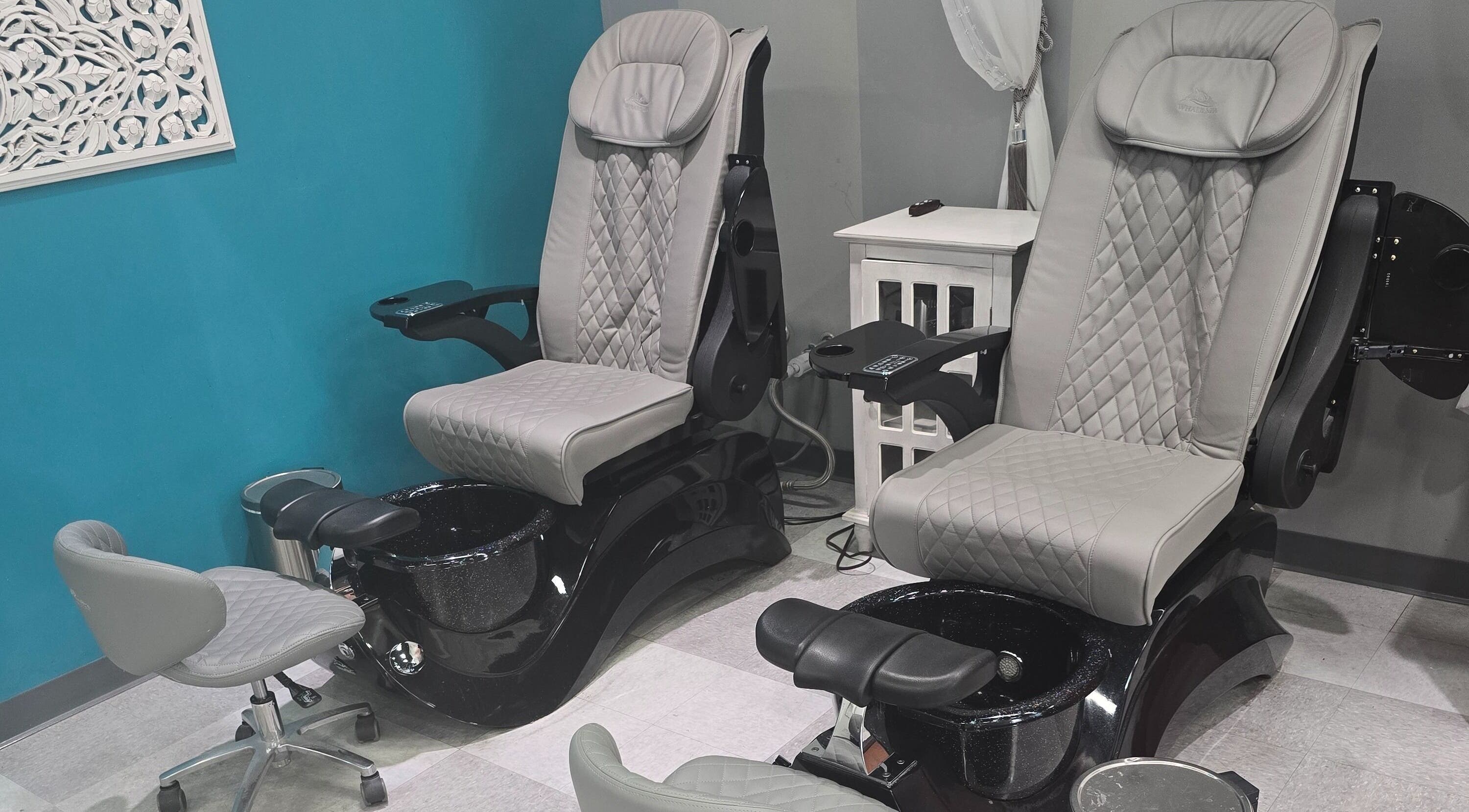 Elegant pedicure spa chairs at Sasco Nails in Henderson, Nevada, US with plush seating and modern design.
