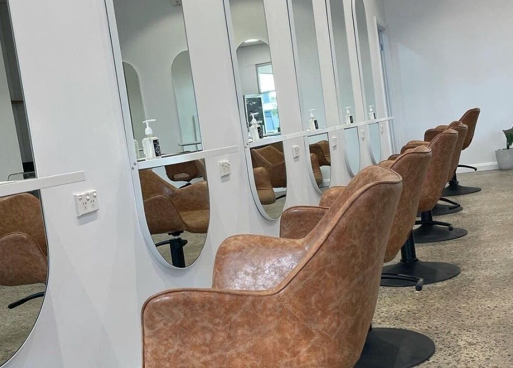Elegant salon chairs at The Hairbar Studio, Castle Hill, New South Wales, AU, offering a sleek and modern setting.