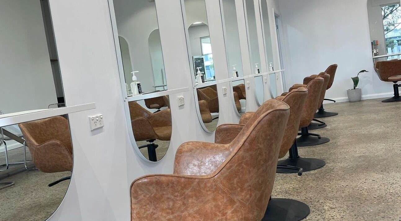 Elegant salon chairs at The Hairbar Studio, Castle Hill, New South Wales, AU, offering a sleek and modern setting.