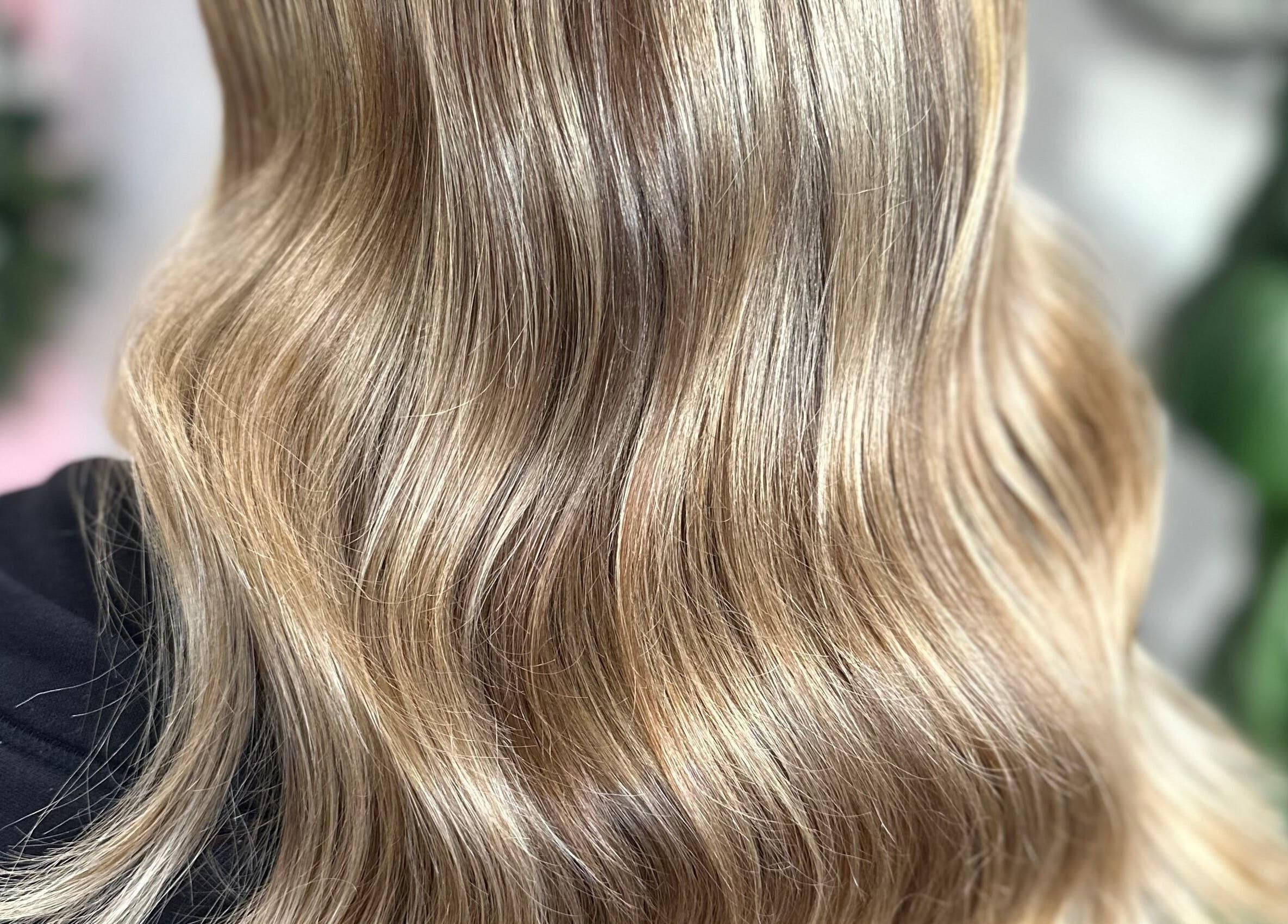 Elegant wavy blonde hair styled at The Hairbar Studio, Castle Hill, New South Wales, AU.