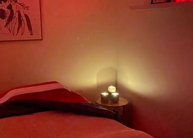 Relaxing spa room at Noala Home Beauty and Massage, Aranda, Australian Capital Territory, featuring dim lighting.