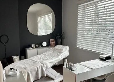 Spa room at Beauty By Freya MCR, Cheadle Hulme, England, GB with a treatment bed and serene decor.