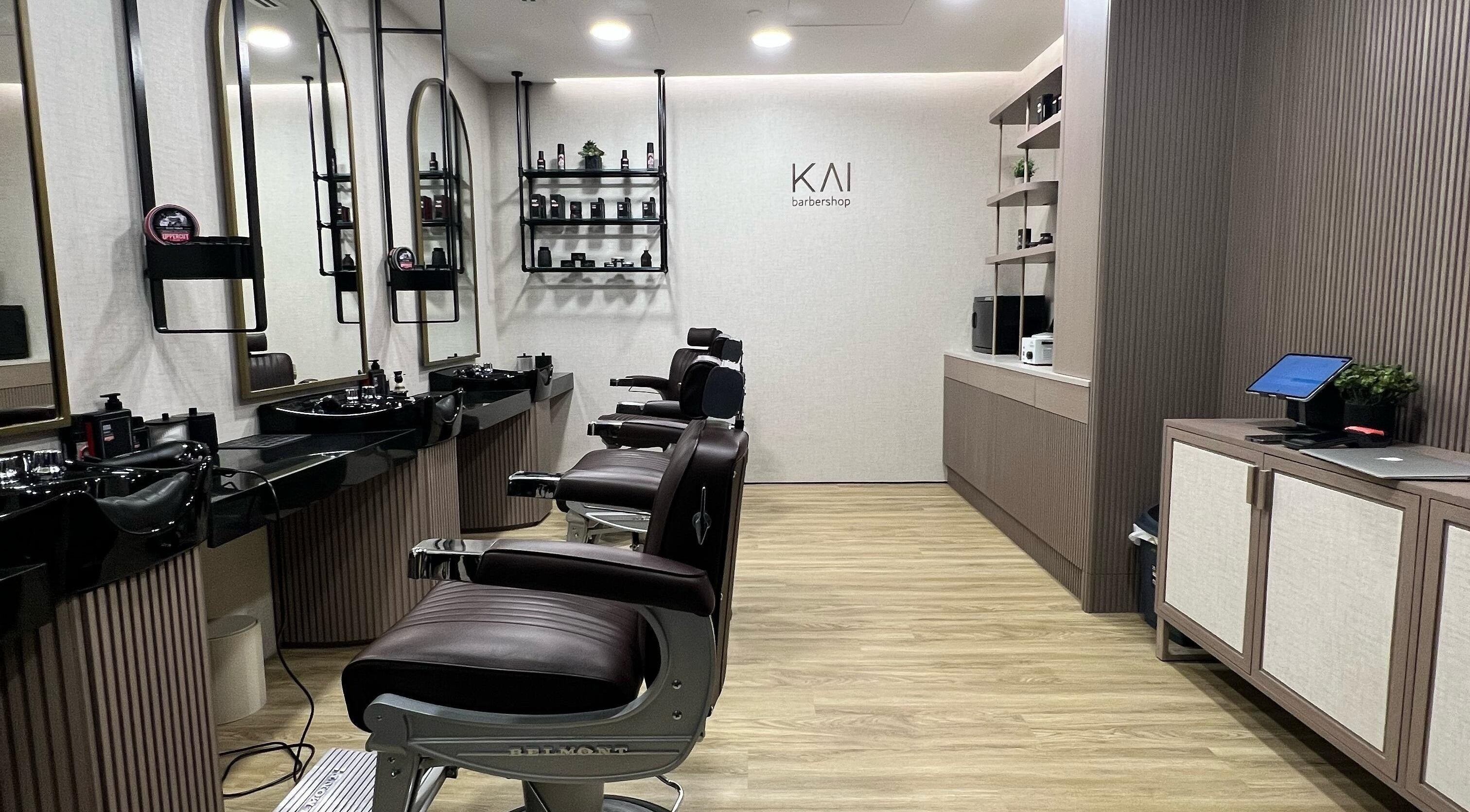 KAI Barbershop interior in Abu Dhabi with modern chairs and styling stations.