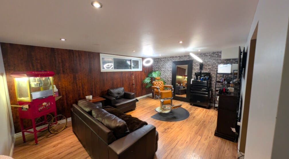 Interior of The Faded Barber in Brantford, Ontario, CA, showcasing vintage barber chair and sleek design.