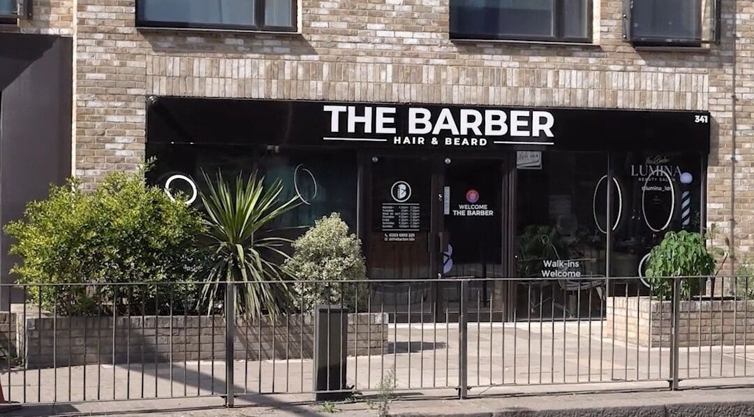 The Barber entrance in London, England, GB, showcasing a modern exterior with inviting signage.