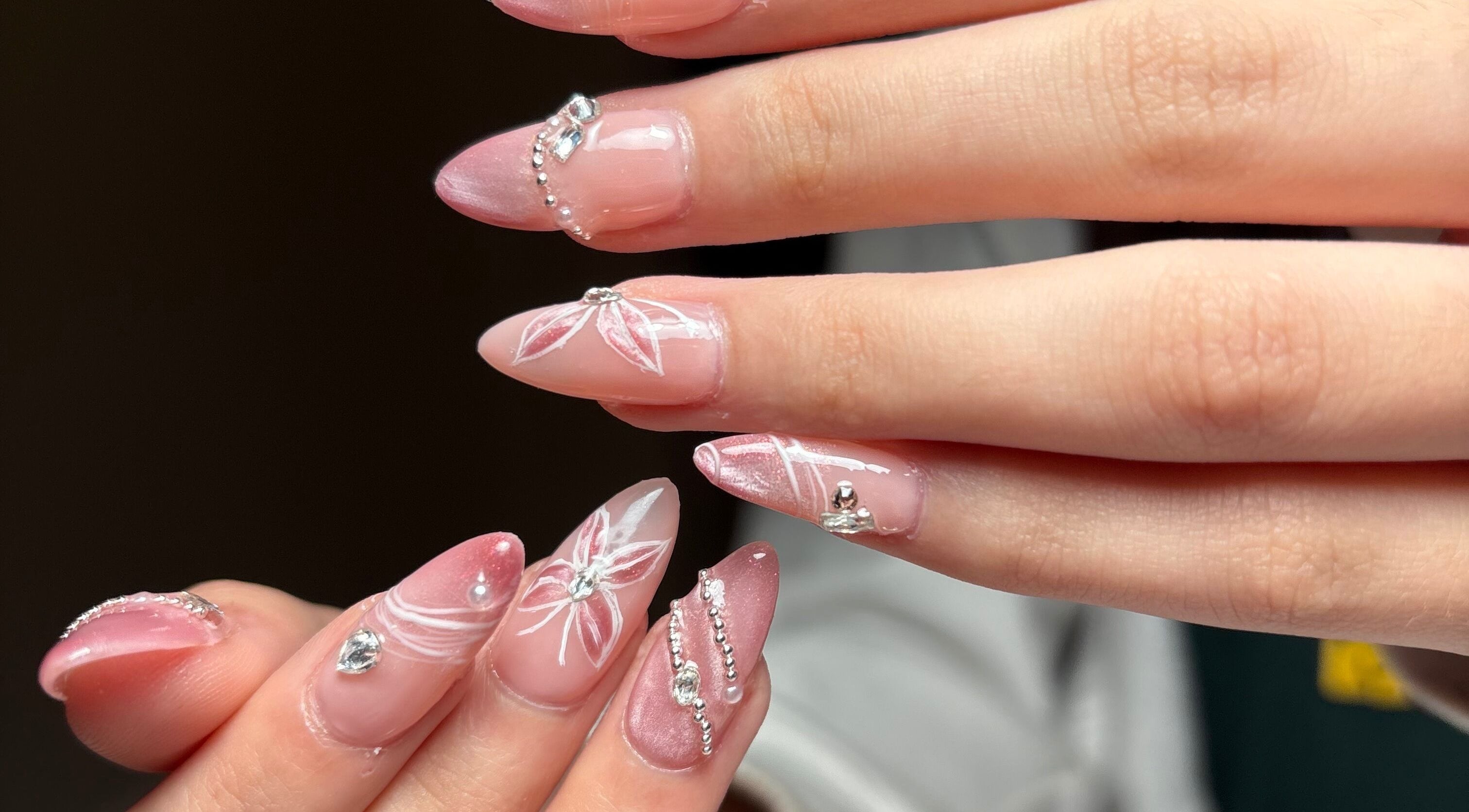Elegant pink and white floral nail art with gems at Clawed By Chl, Edmonton, Alberta, CA.