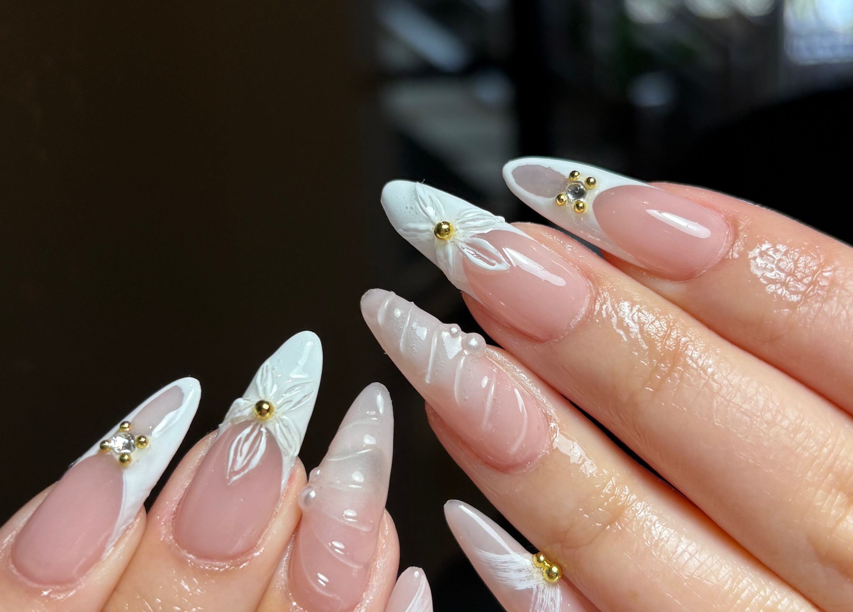 Detailed nail art with floral design and gems by Clawed By Chl in Edmonton, Alberta, CA.