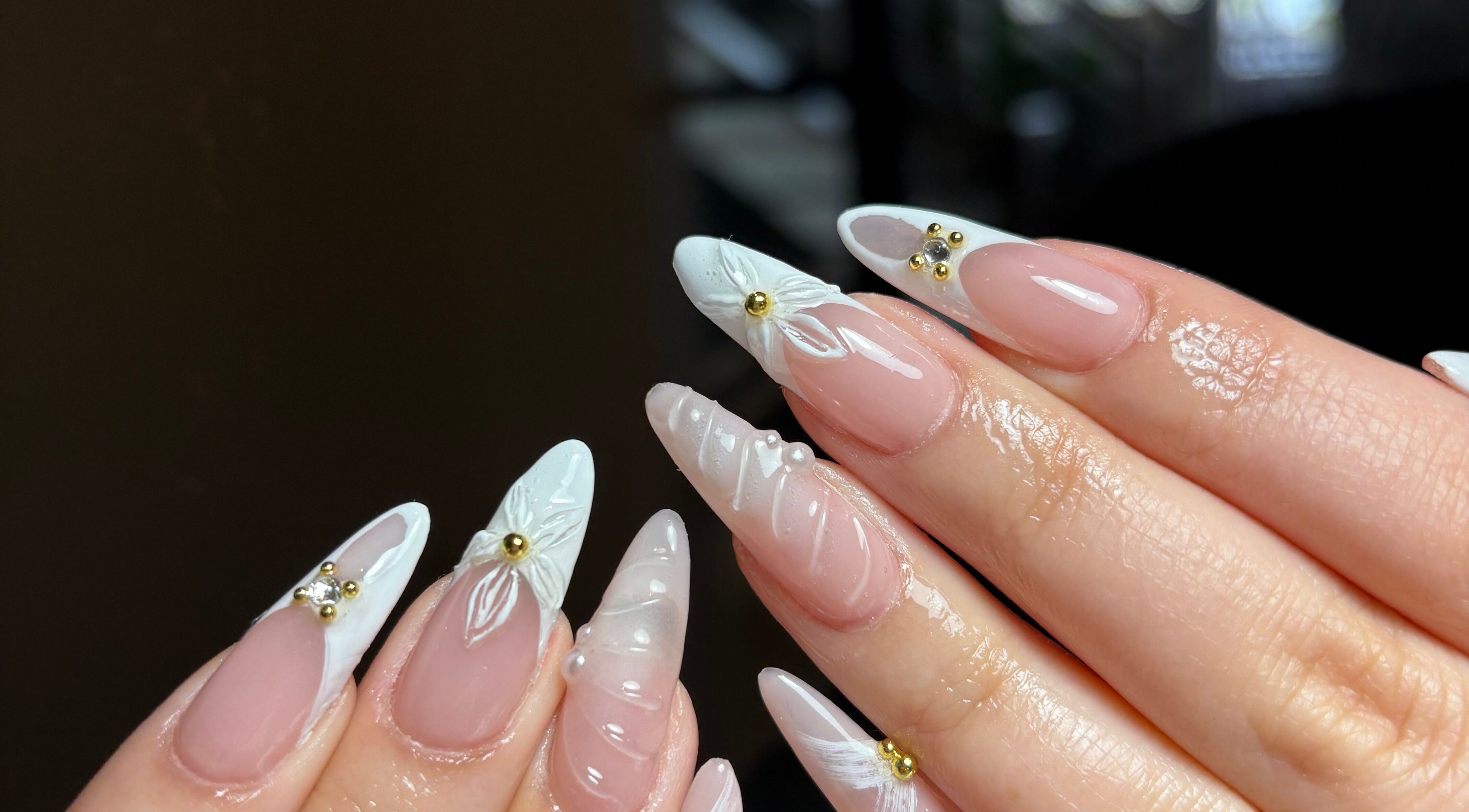 Detailed nail art with floral design and gems by Clawed By Chl in Edmonton, Alberta, CA.