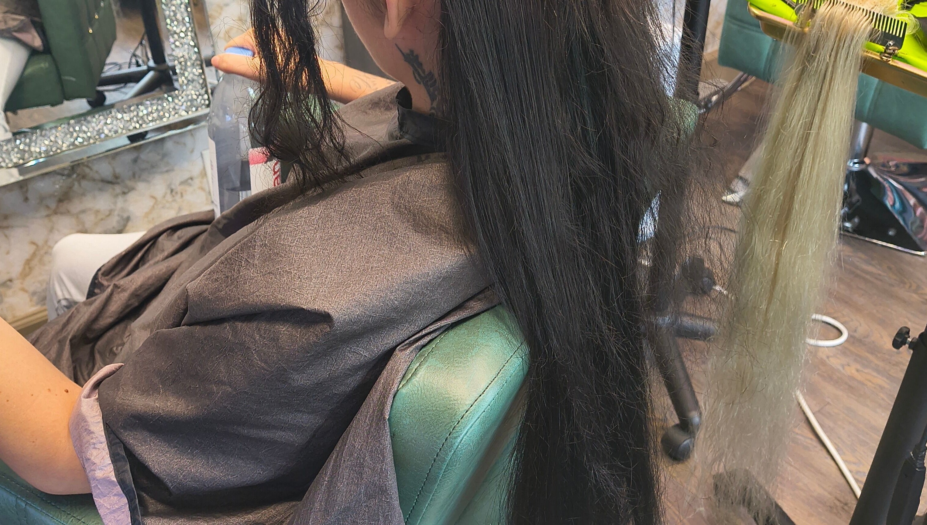 Professional hair extension application at Celine’s Hair in Lighthouse Point, Florida, US.