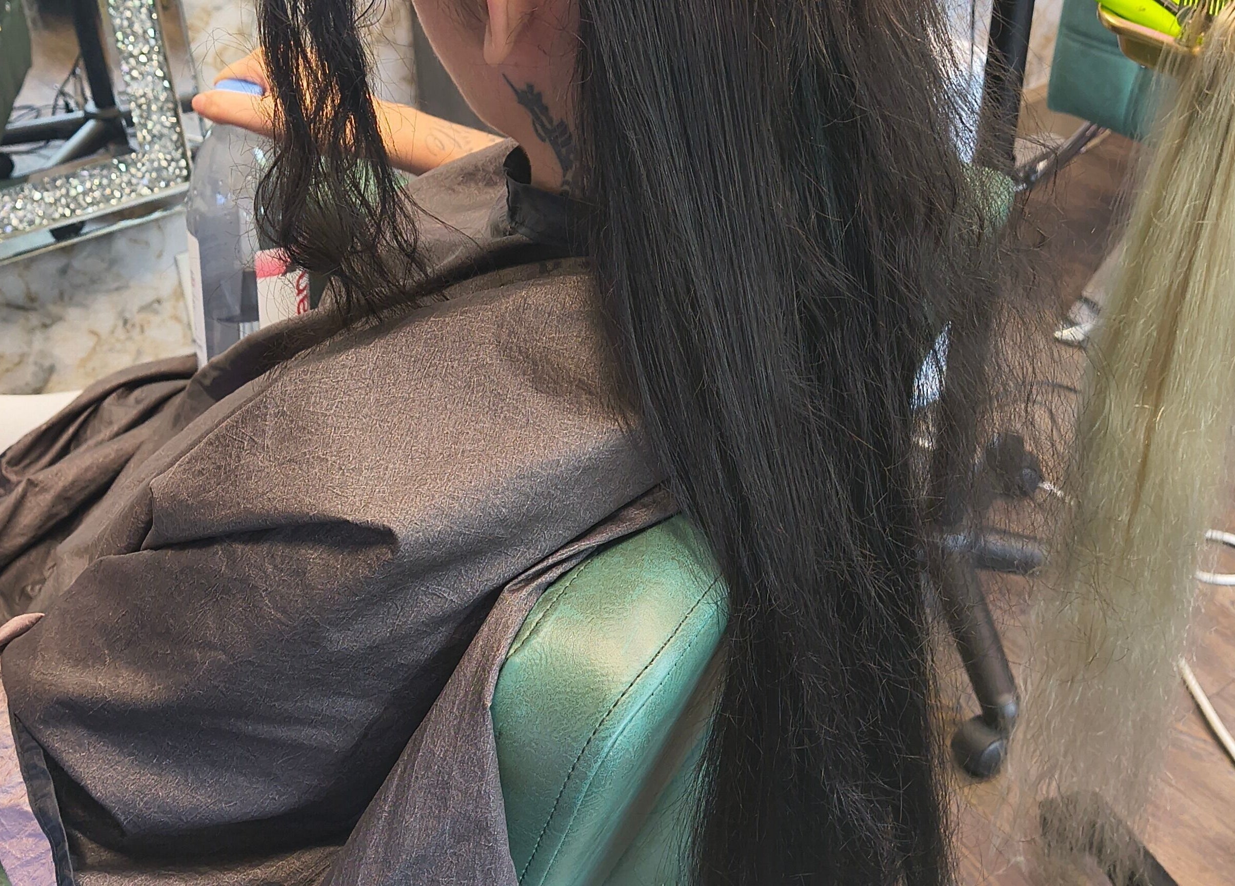 Professional hair extension application at Celine’s Hair in Lighthouse Point, Florida, US.