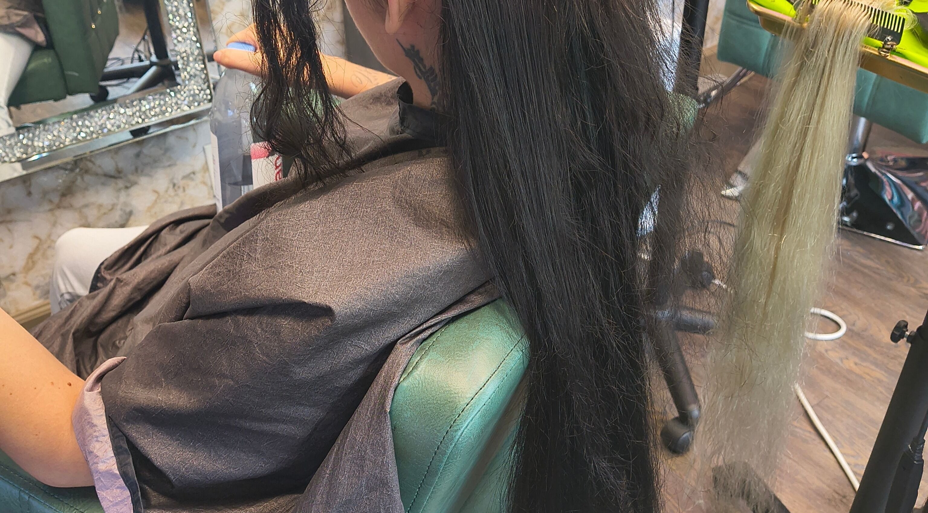 Professional hair extension application at Celine’s Hair in Lighthouse Point, Florida, US.