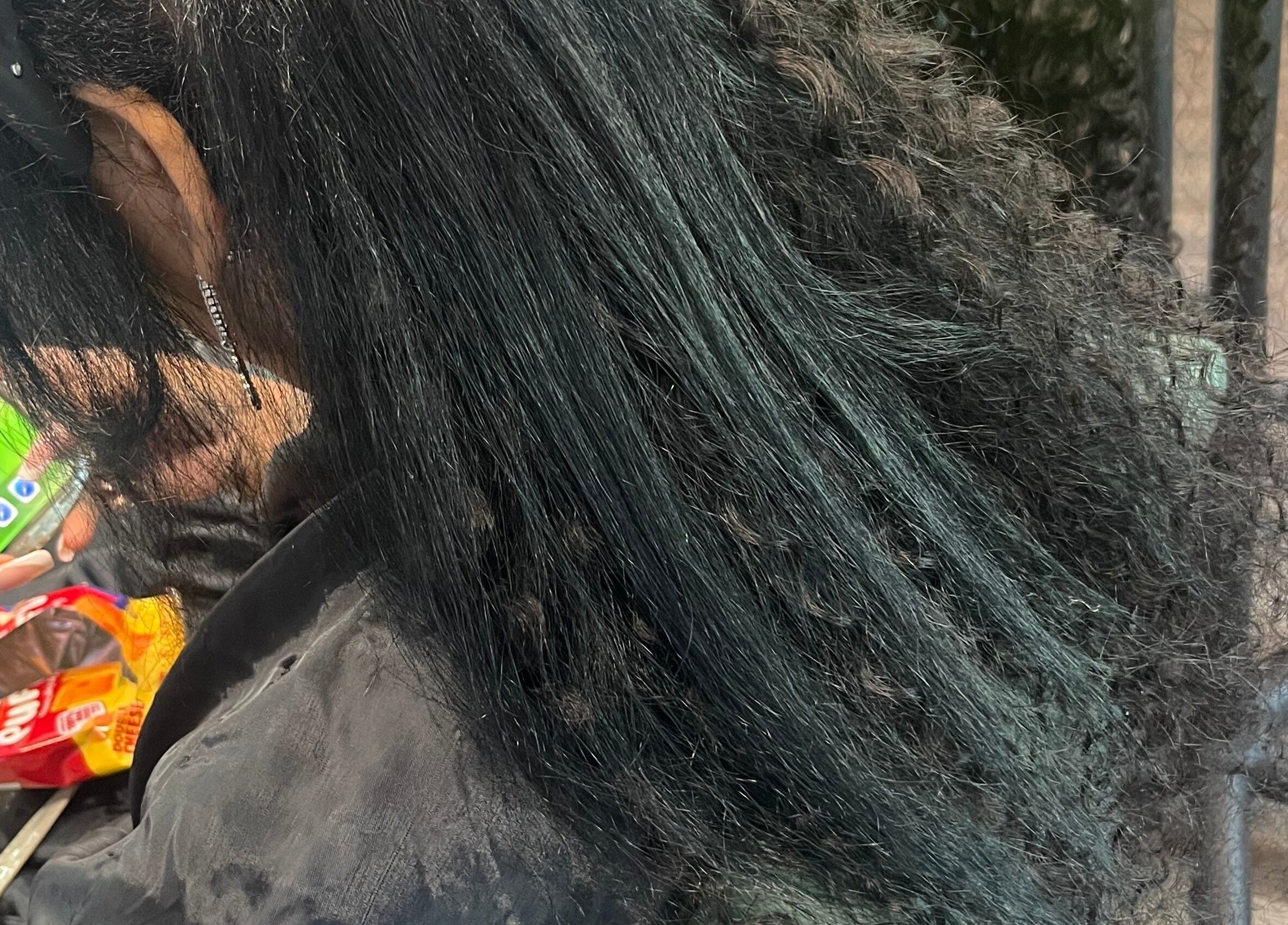 Client receives sleek hairstyling at Celine’s Hair, Lighthouse Point, Florida, US, showcasing shiny, straight hair.