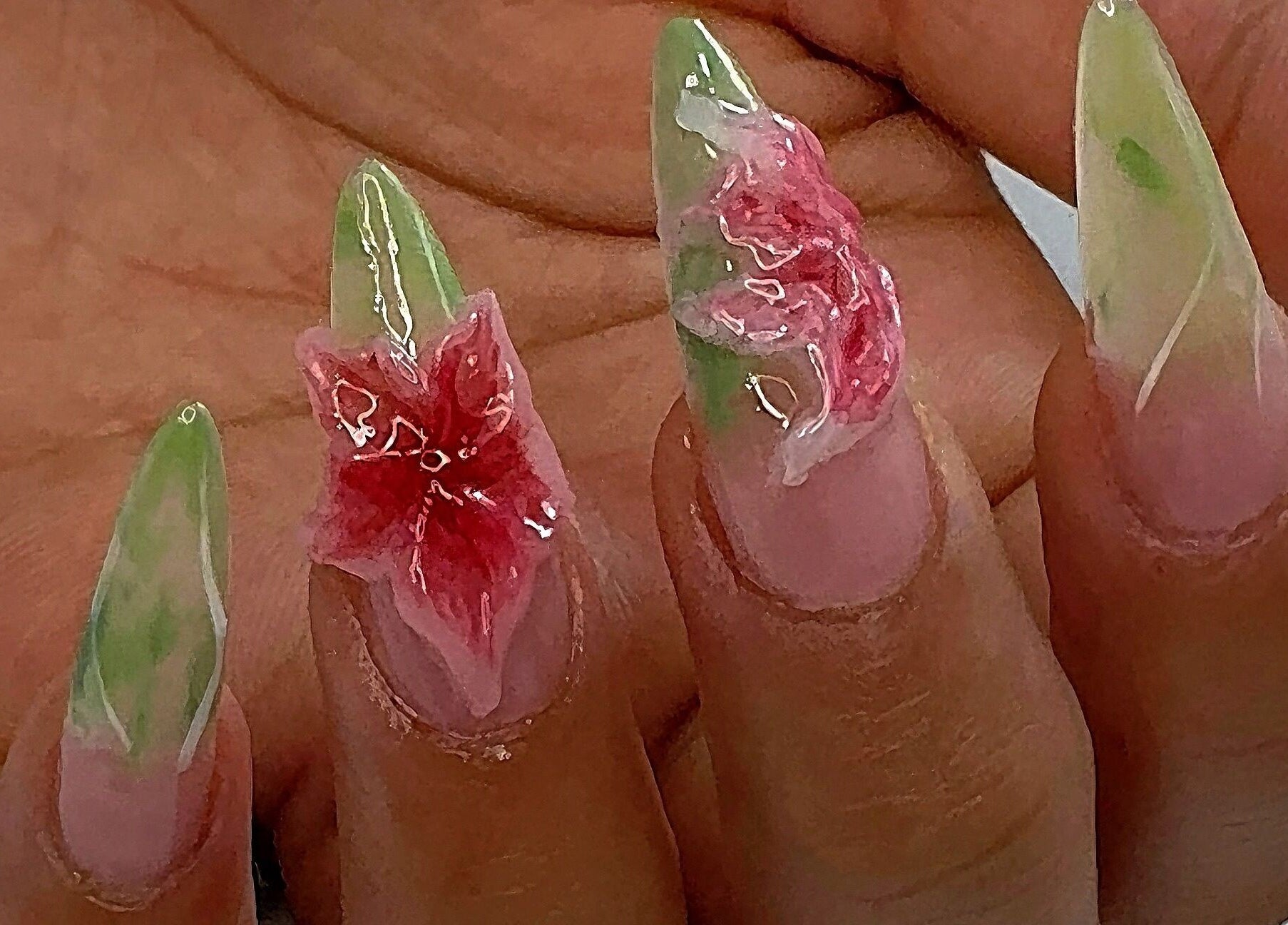 Delicate floral nail art from AK Nails in Thornton, New South Wales, AU, showcasing green and pink accents.