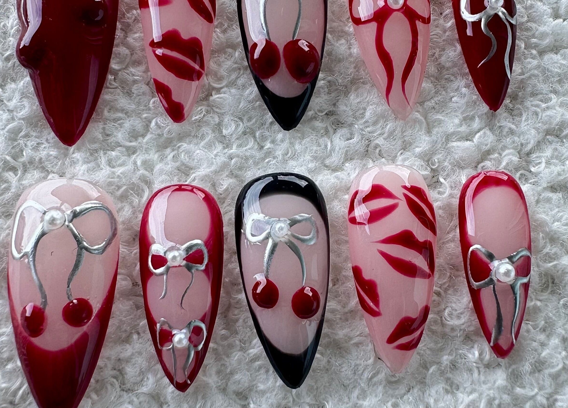 Stylish cherry and ribbon nail art design at AK Nails, Thornton, New South Wales, AU.