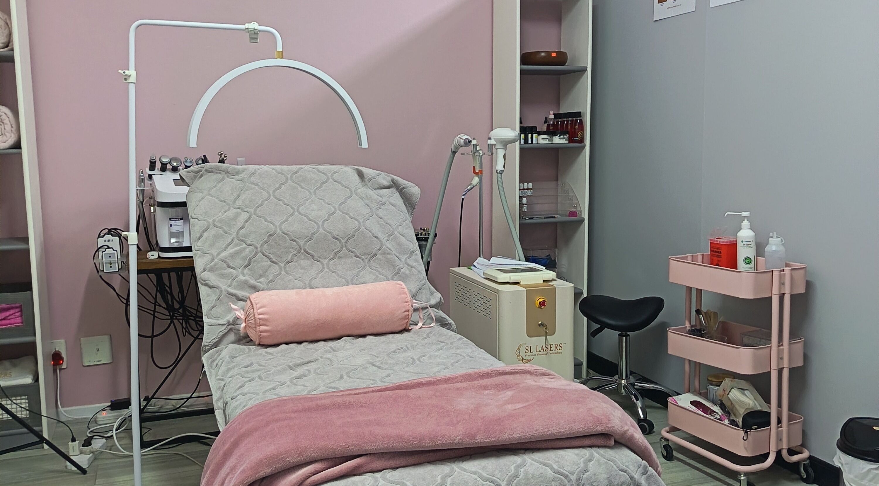 Luxurious spa treatment room at The Glam Lab, Hartbeespoort, North West, ZA, featuring modern equipment.