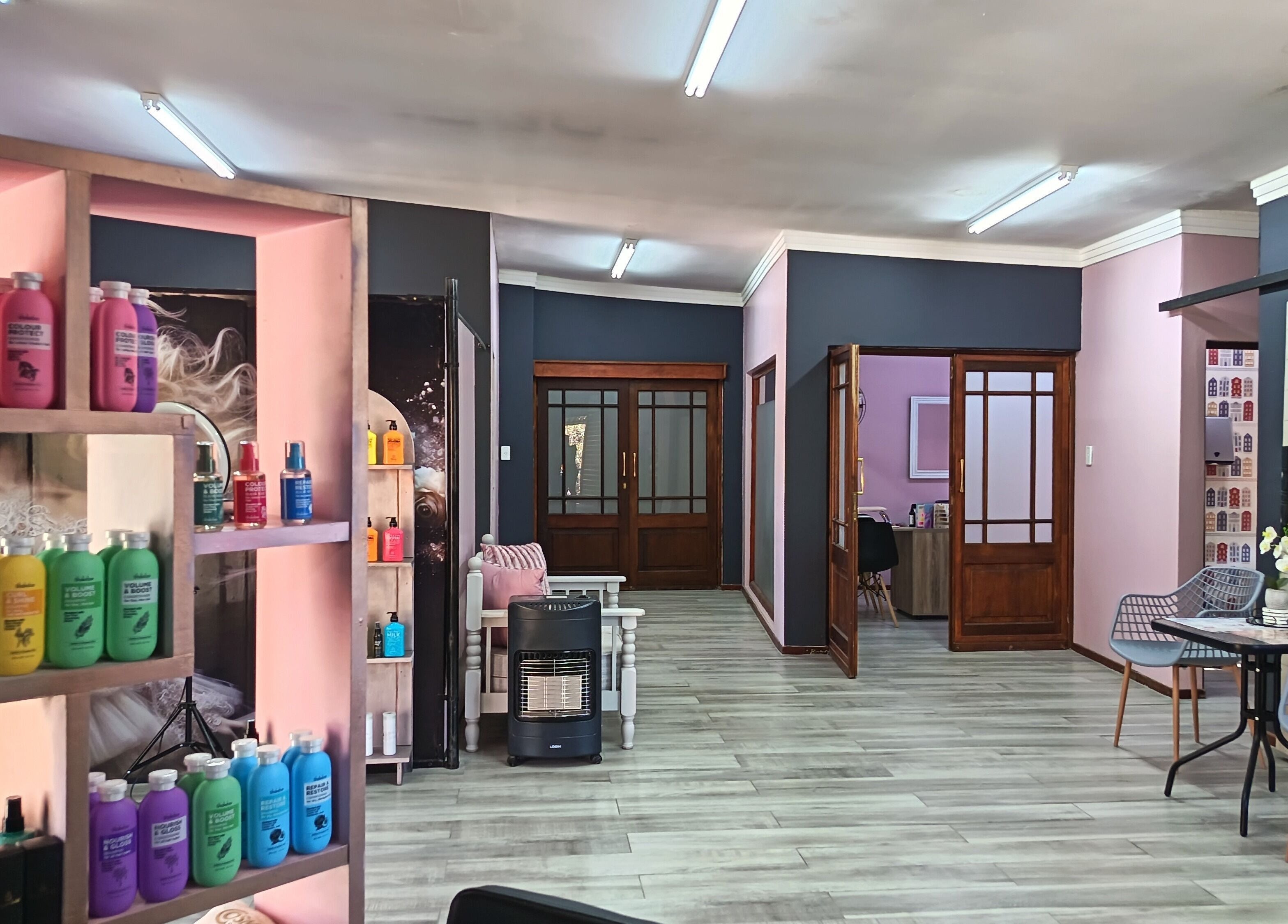 Inside view of The Glam Lab in Hartbeespoort, North West, ZA showcasing shelves of vibrant beauty products.